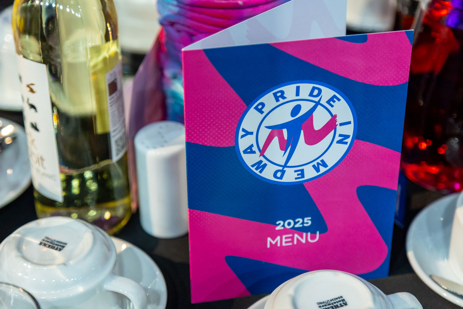 A Pride in Medway set table with a designed menu